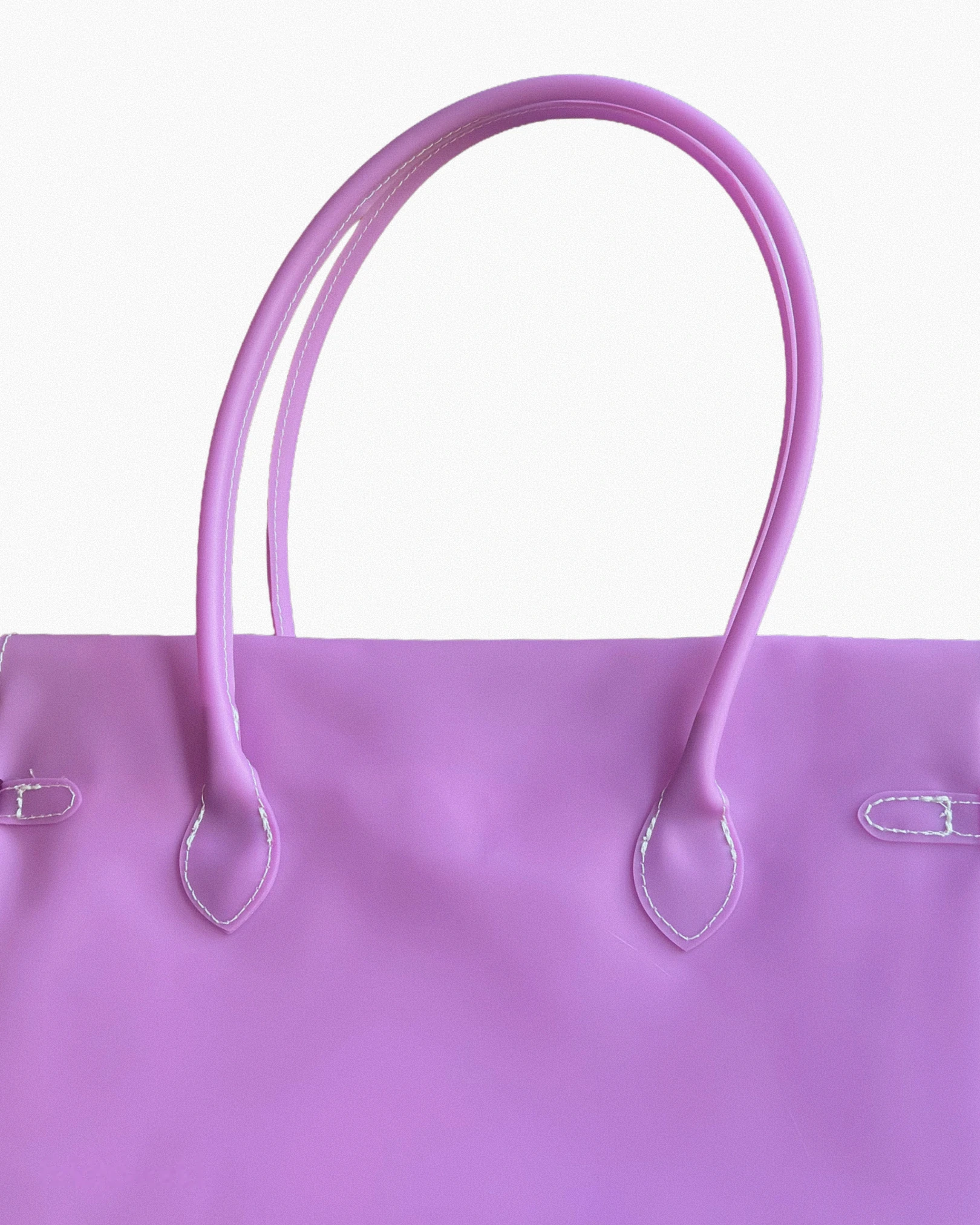 magenta-pink PVC jelly tote seen from the back, with two rolled pink handles